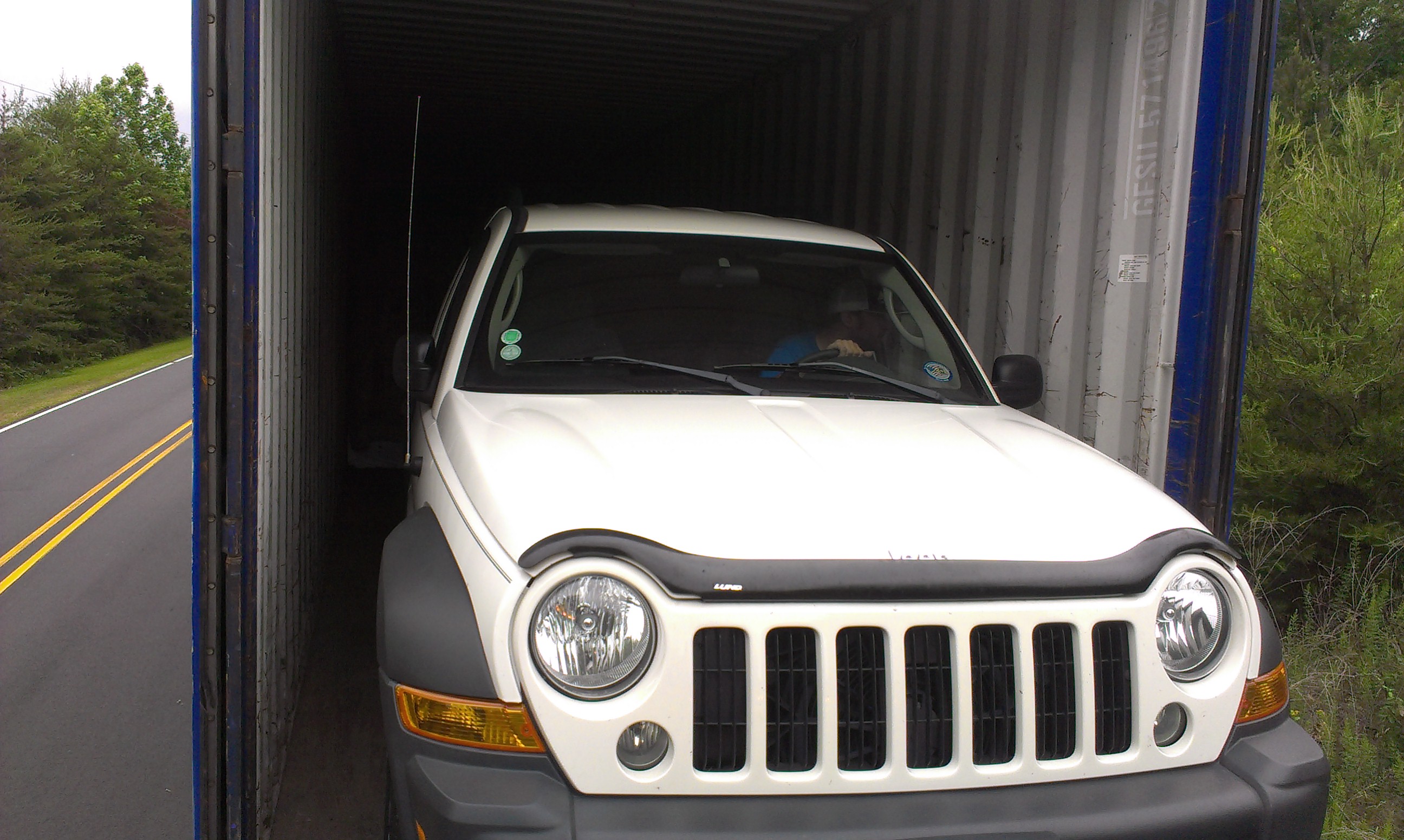 packing-service-inc-loading-car-into-shipping-container